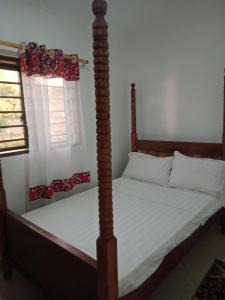 Postel nebo postele na pokoji v ubytování Spacious Studio Accomodation Muhara