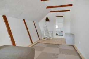 a living room with a couch and a table at Completely Renovated Holiday Apartments in Løkken