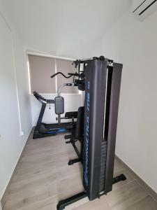 a room with a gym with a exercise bike at Villa Sabine in Trogir