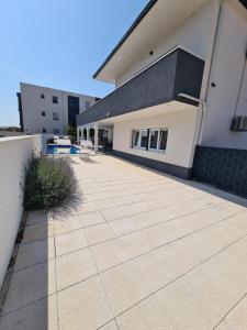 a building with a tile driveway in front of it at Villa Sabine in Trogir