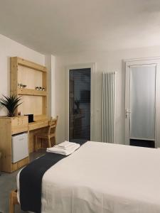 Postel nebo postele na pokoji v ubytování Olea b&b