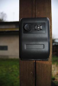 a close up of a black electrical outlet on a wooden post at Türi Puhkemaja - Murunella in Türi