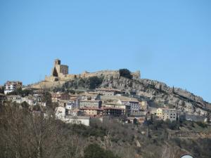 a town on a hill with a castle on top at Apartamento Benabarre Huesca in Benabarre