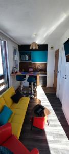 a living room with a couch and a table at Orcières Rond Point des Pistes 1 Panoramique, Front de Neige in Orcières