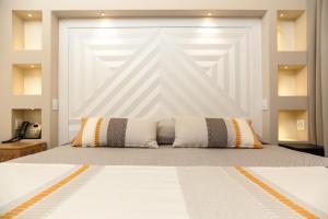 A bed or beds in a room at Hotel Club Saraceno - Bovis Hotels
