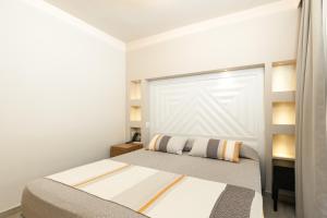 A bed or beds in a room at Hotel Club Saraceno - Bovis Hotels