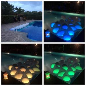 a group of four pictures of a pool with candles at La Famiglia in Vasanello