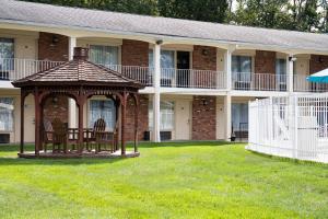 a gazebo in the yard of a house at Crystal Inn Eatontown in Eatontown