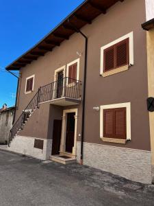 a house with a staircase on the side of it at Da Nonna Maria in Celano