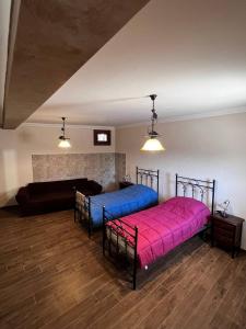 a bedroom with two beds in a room at Da Nonna Maria in Celano