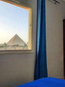 Letto o letti in una camera di Aton pyramids view guest house