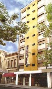 a yellow building on the side of a street at Blanro Hotel in Buenos Aires