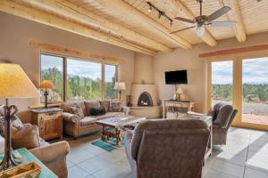 a living room with a couch and a fireplace at Casa Cielo in Taos