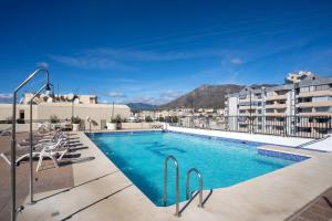 a swimming pool on the roof of a building at Deluxe Apartment on the First Line in Marbella