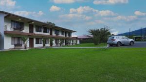 a car parked in front of a building at Condo's Vista Al Volcan in Fortuna