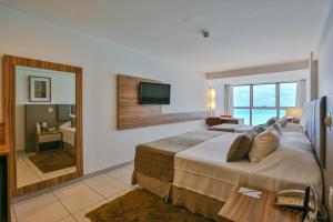 Postel nebo postele na pokoji v ubytování Flat Beach Class Executive + 37 fotografií