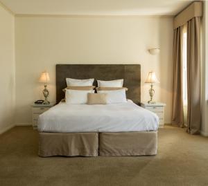 Postel nebo postele na pokoji v ubytování Beau Monde International