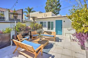 a patio with chairs and a table in front of a house at Luxe Laguna Home with Ocean View Walk to Beach in Laguna Beach
