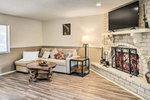 a living room with a couch and a fireplace at Bullhead City Home - Near Colorado River! in Bullhead City