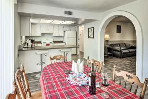 a kitchen and dining room with a table and chairs at Bullhead City Home - Near Colorado River! in Bullhead City