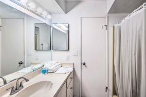 a bathroom with a sink and a mirror and a shower at Bullhead City Home - Near Colorado River! in Bullhead City +16 photos