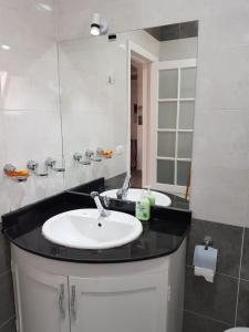 a bathroom with two sinks and a mirror at Flat 01 bed room. Sea Street. Hadaba Area. in Sharm El Sheikh