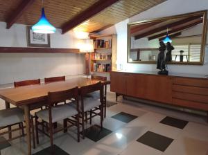 a dining room with a table and chairs and a mirror at Inhome in Madrid