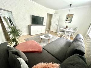 a living room with a couch and a table at Carolina in Aalborg