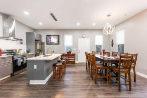 a kitchen and dining room with a table and chairs at The Gathering House for Family and Friends in Columbus