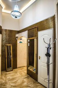 a room with a door and a mirror at Exclusive Apartmanok Szeged in Szeged +97 photos
