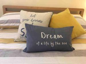 a pillow that says dream of a life by the sea at Tre Mynach Barmouth in Barmouth