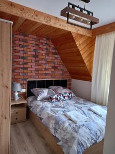 Posteľ alebo postele v izbe v ubytovaní Apartament 6 osobowy Pasternik