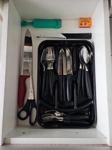 a drawer full of utensils in a refrigerator at 01 APTO em frete ao Shopping Pátio Norte in São-José-do-Ribamar