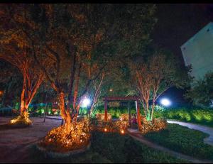 a park at night with trees and a playground at Apartamento mobiliado e aconchegante in Rio de Janeiro