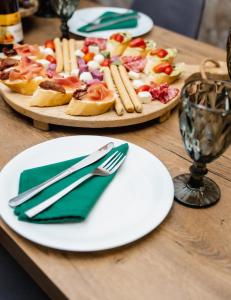 a plate of food on a table at Hotel DENINNA in Vinnytsya