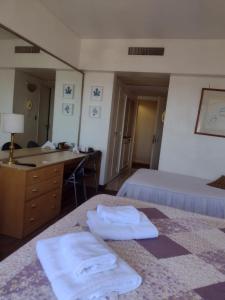 En eller flere senge i et værelse på Departamento Corrientes Av. + 8 billeder