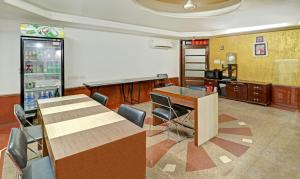 a conference room with a table and chairs and a screen at Treebo Trend Sky 5 in Chandīgarh
