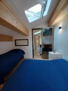 Posteľ alebo postele v izbe v ubytovaní L'appartement au cœur de Sète.