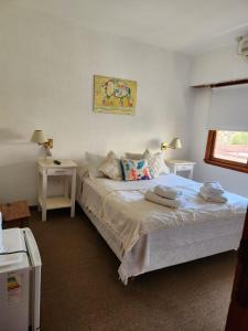 Una cama o camas en una habitación de Hotel Barracuda