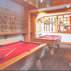a billiard room with two pool tables in it at the fishing boat in Port Seton