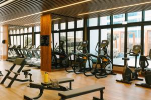 a gym with a bunch of exercise bikes in it at Sonder Business Bay in Dubai