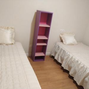 Posteľ alebo postele v izbe v ubytovaní Piso céntrico nuevo