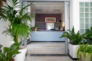 an office with potted plants in the entry way at Hotel Royal in Giulianova