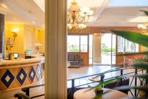 a lobby of a hotel with a reception desk at Hotel Villa Romana in Porto Empedocle