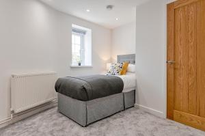 En eller flere senger på et rom på 2 bedroom flat in The Mumbles with free parking