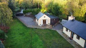 an aerial view of a small house in a yard at 1 bedroomed Detached holiday retreat Pant in Oswestry
