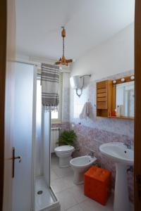 a bathroom with a shower and a toilet and a sink at Otranto perla d'Oriente in Otranto