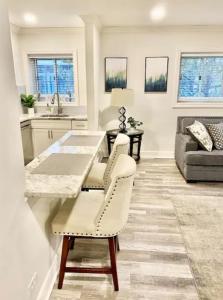 a kitchen and living room with a table and chairs at Cozy Downtown Atlanta Condo in Atlanta