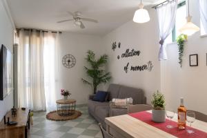 a living room with a couch and a table at Nel cuore di Otranto in Otranto
