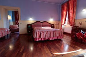 Postel nebo postele na pokoji v ubytování Hotel Corte dei Tini